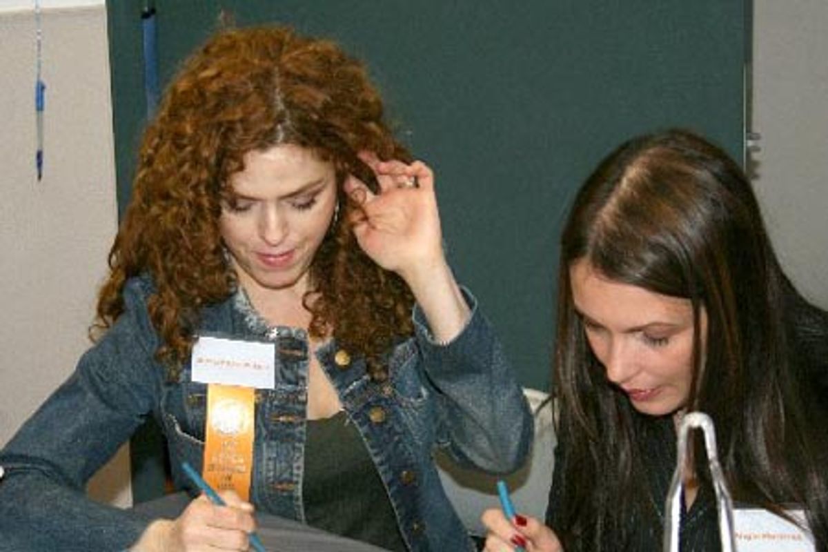 Bernadette Peters and Angie Martinez tabulating scores to determine a winner at 