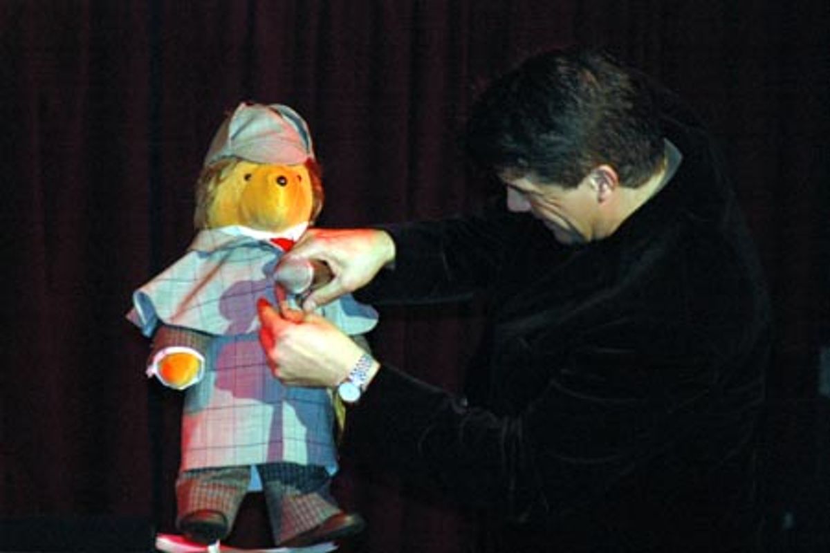 Bryan Batt buttoning the coat of Baker Street Sherlock Holmes Bear at 