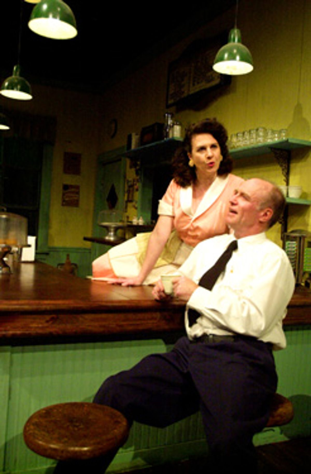 Diner owner Joanne Fayan (left) as Grace flirts with bus driver Walter Cotter (right) as Carl  at 