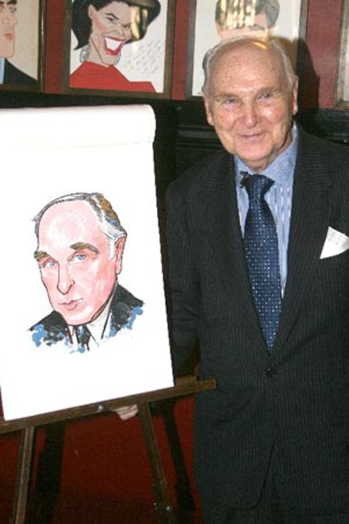Donald Saddler with his caricature at 