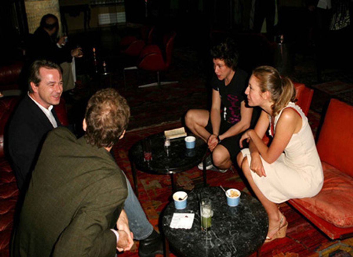 Playwright Nina Raine (right) chats with her brother Moses Raine at 