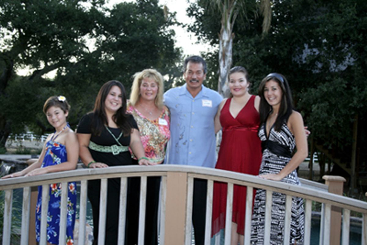 Mark and Sue Younger, flanked by their daughters at 