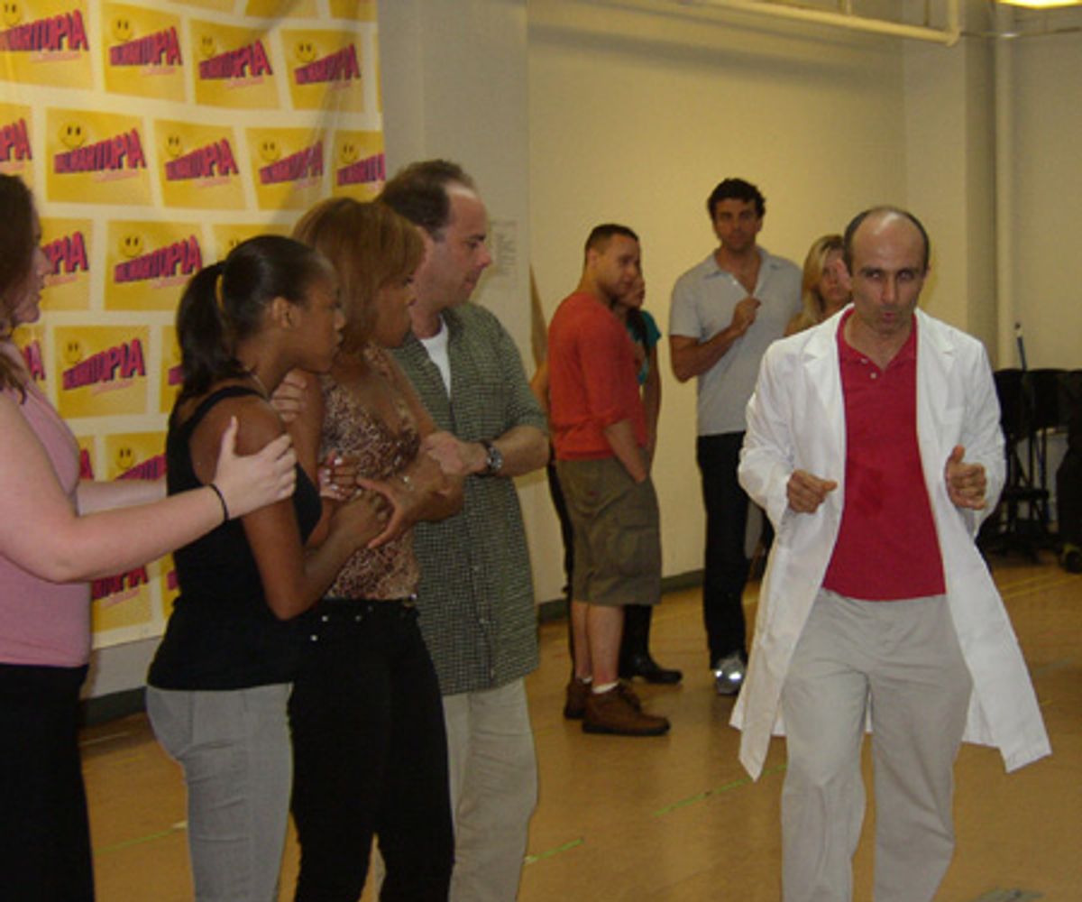 Stephen DeRosa (in white coat) and ensemble at 