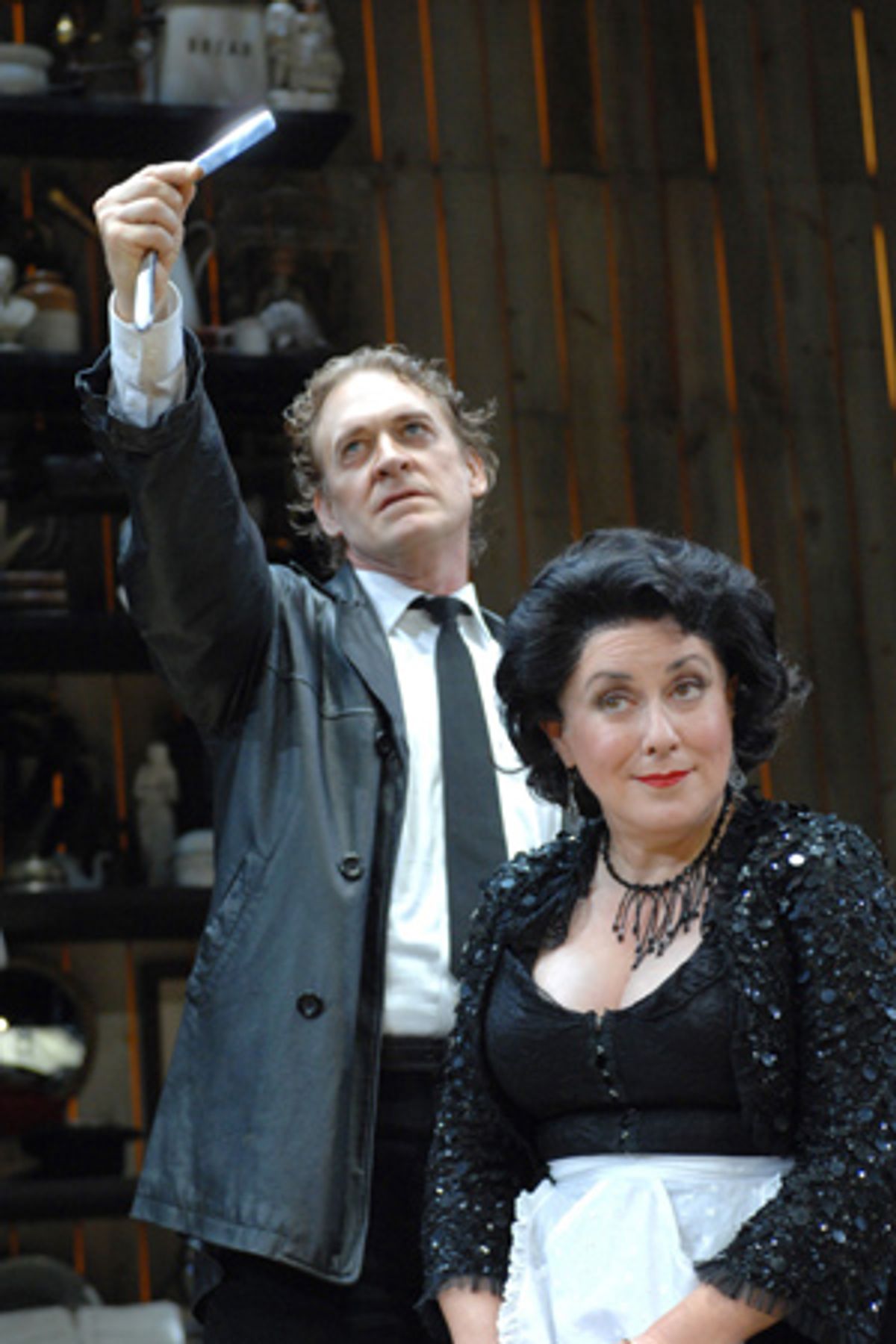
Sweeney Todd (David Hess) and Mrs. Lovett (Judy Kaye) conspire to 'shave the faces of gentlemen who never thereafter were heard of again' at 