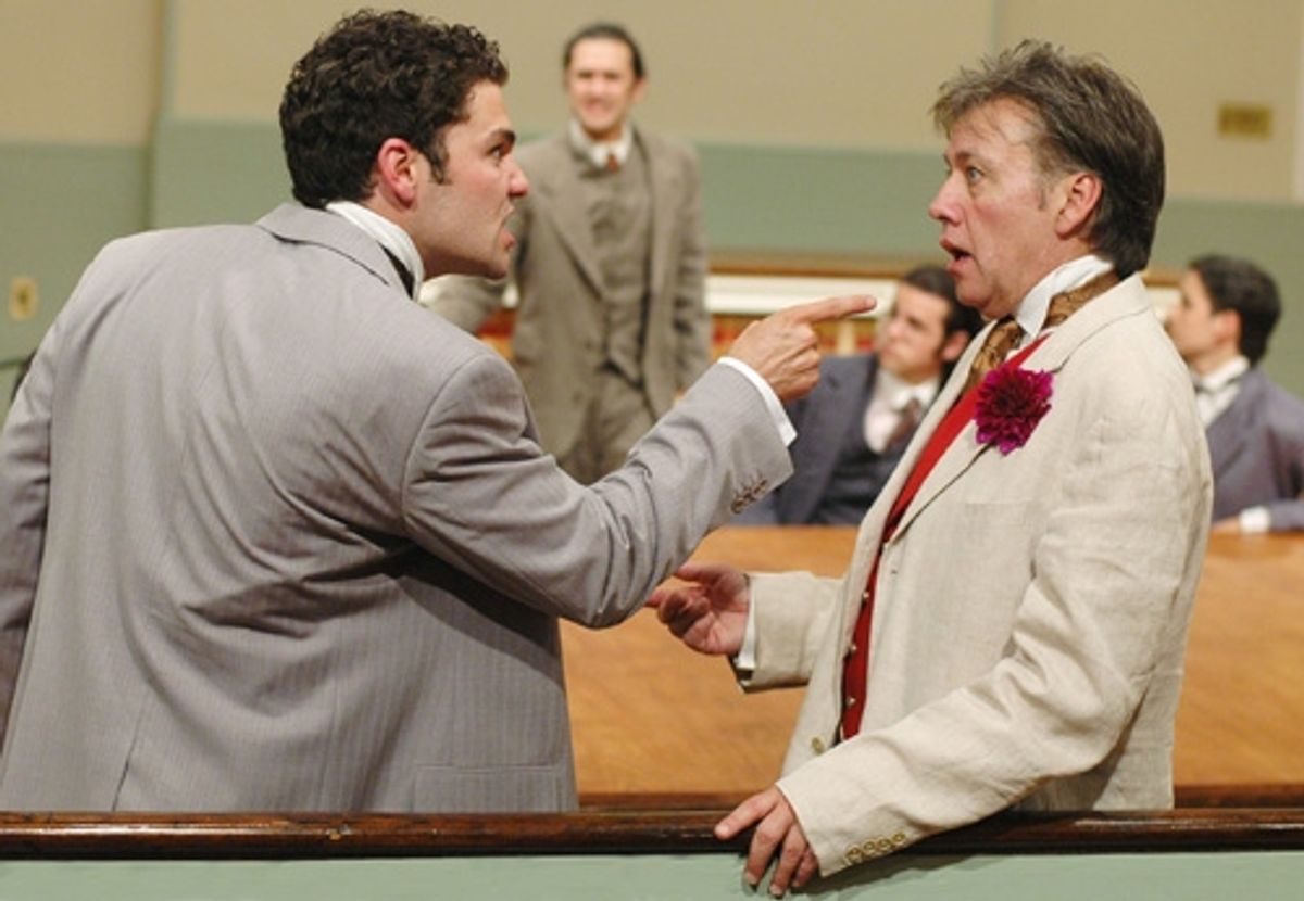 Lord Alfred Douglas (left, Ara Boghigian) persuades Oscar Wilde (right foreground, JM Richardson) to continue with the lawsuit with (rear l-r) Frank Harris (Patrick Poole), Kaufman (Dillon Medina), and Taylor (Ryan Maxwell) in attendance. at 