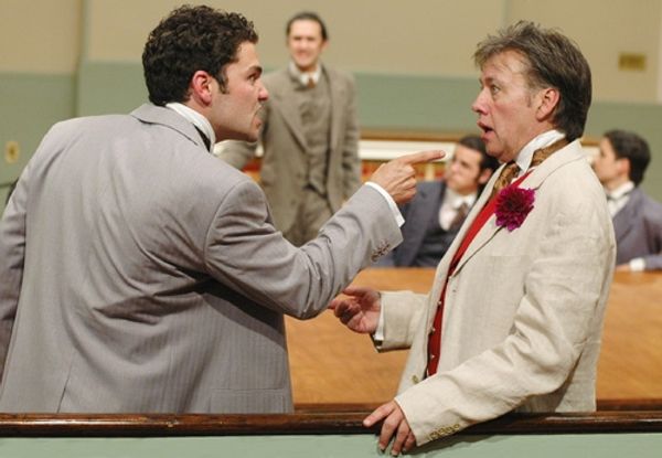 Lord Alfred Douglas (left, Ara Boghigian) persuades Oscar Wilde (right foreground, JM Photo