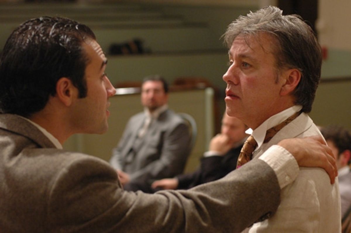 Frank Harris (left, Patrick Poole) comforts his friend Oscar Wilde (right, JM Richardson) while attorneys (rear l-r) Edward Clarke (Joe Henderson) and Edward Carson (Michael Zola) ponder their next move. at 