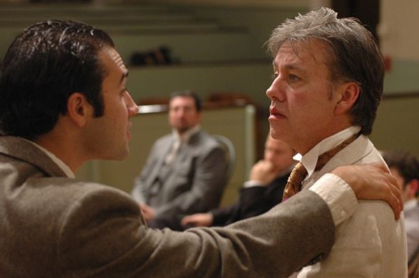 Frank Harris (left, Patrick Poole) comforts his friend Oscar Wilde (right, JM Richard Photo