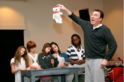Patrick Page dangles a disgusting teddy bear Photo