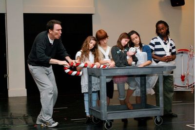 Patrick Page teases with a giant candy cane Photo