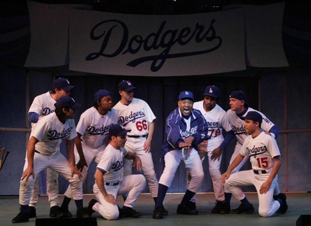 Hassan El-Amin (center) as Coach Burns with the team at 