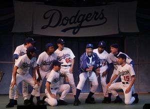 Hassan El-Amin (center) as Coach Burns with the team Photo