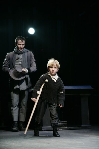 Nick Cordileone as Bob Cratchit and Luke Sauer as Tiny Tim. Photo by T. Charles Erick Photo