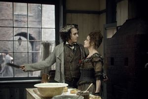 Johnny Depp as Sweeney Todd with Helena Bonham Carter as Mrs. Lovett Photo