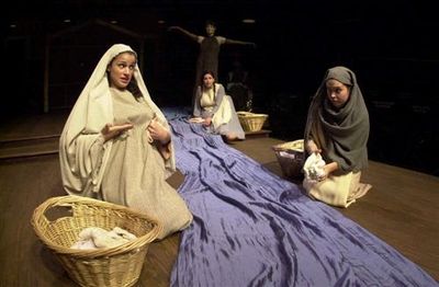 Local village women (far left, Ashley Kenner & far right, Erin Olson) discuss the vir Photo