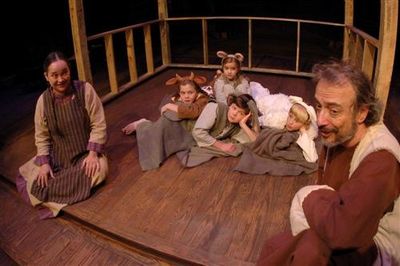 Girl (Amy Thompson) offers her parent's stable to Joseph (far right), which is filled Photo
