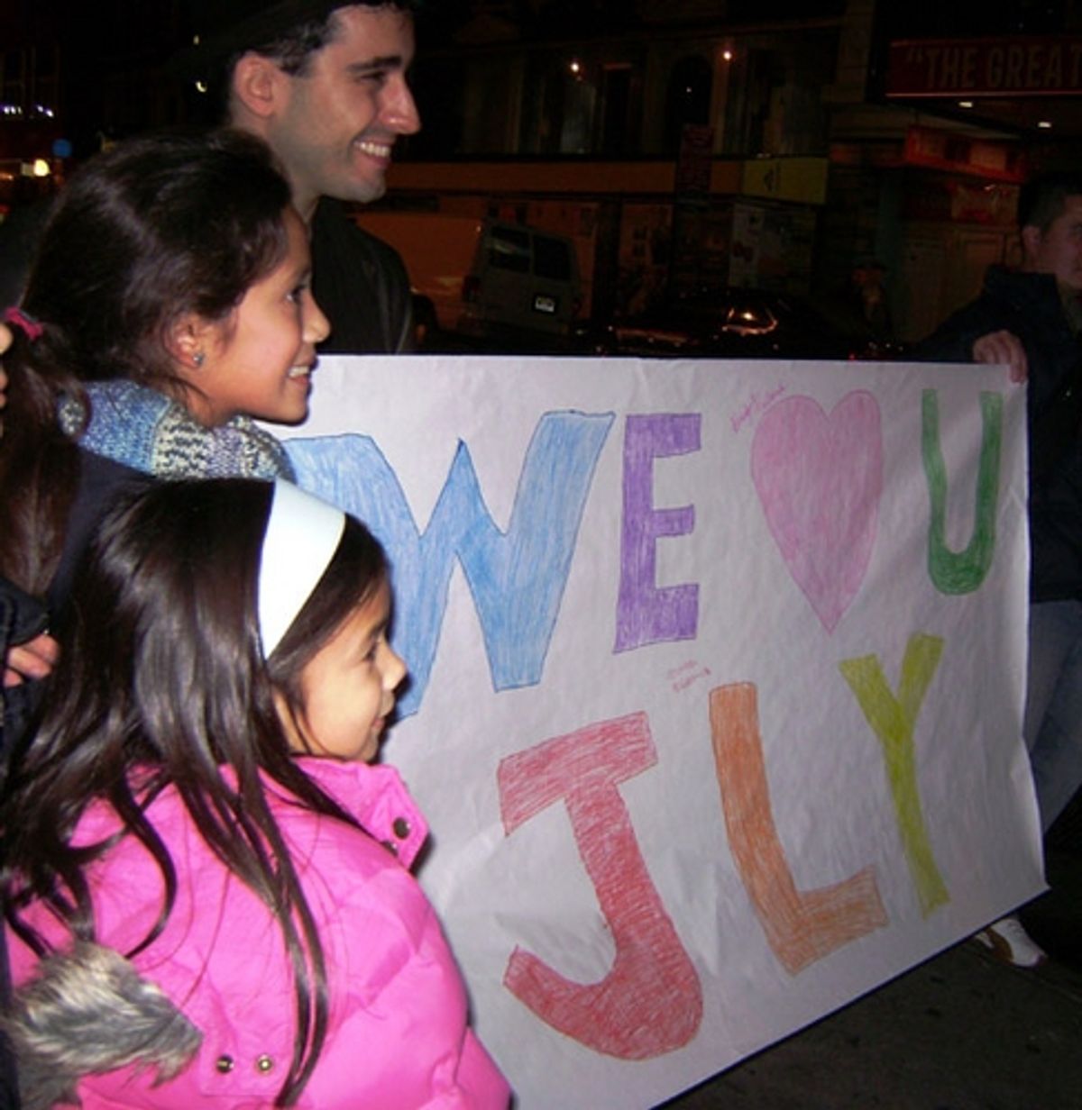 Bridget Niebanck, Maddi Niebanck with John Lloyd Young and banner  at 