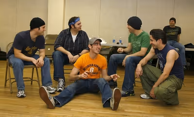 Max Crumm rehearses with the cast of Grease Photo