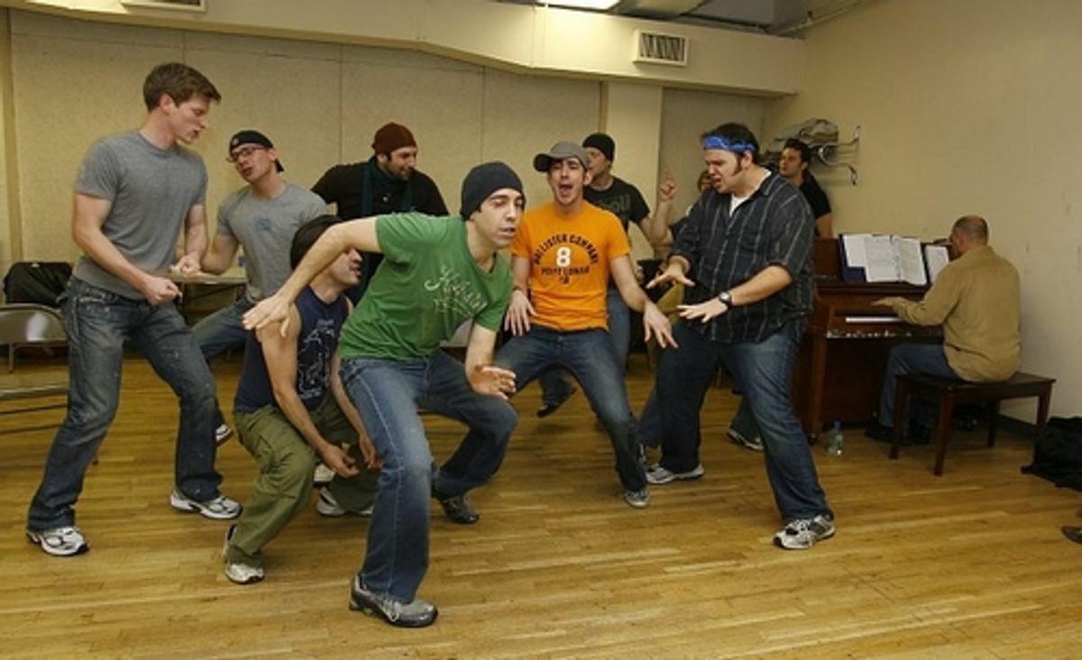 Max Crumm rehearses with the cast of Grease at 