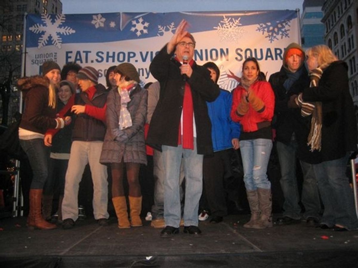 Paul Kreppel (center) led the casts in a holiday carol at 