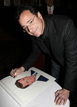 Bob Saget autographs his caricature
 Photo