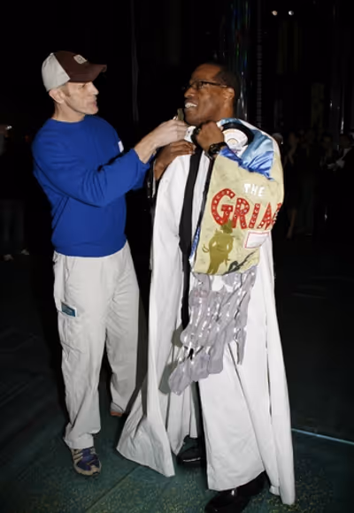 William Ryall bestows the Gypsy Robe upon Adrian Bailey Photo