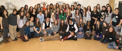 Group shot with John Gallagher Jr. (center) Photo
