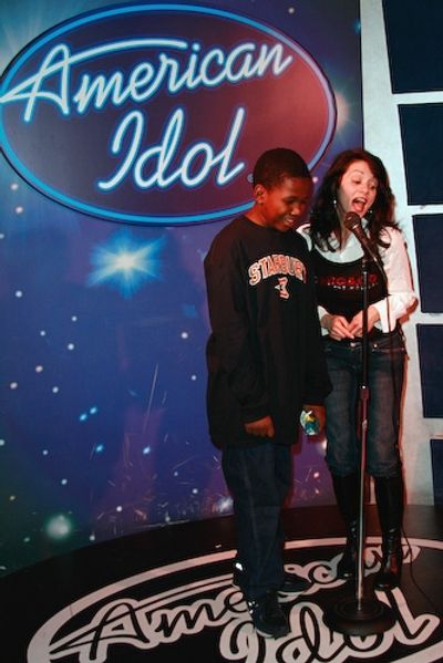 Chicago's Donna Marie Asbury sings karaoke with a guest Photo