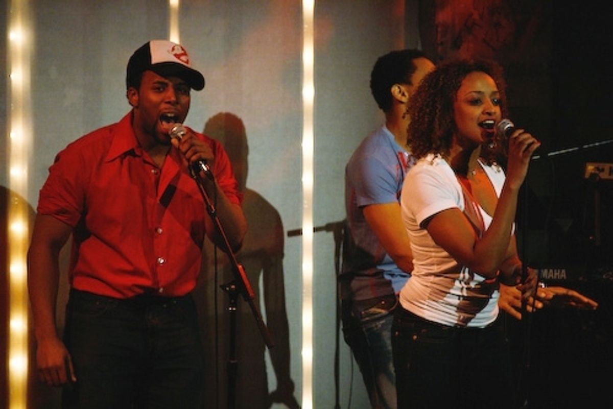 Maurice Murphy, Asmeret Ghebremichael and Derrick Baskin rouse the crowd with the opening theme-song at 