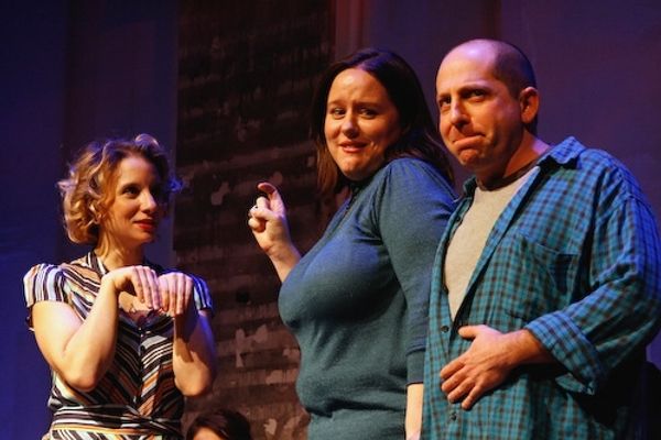 Sarah Saltzberg (an evil ground-hog) terrorizes villagers Tara Copeland and Jason Kra Photo