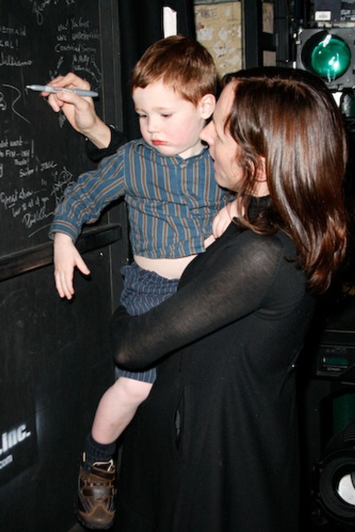 Molly Shannon and son Nolan Shannon Chestnut sign the special-guest wall at 