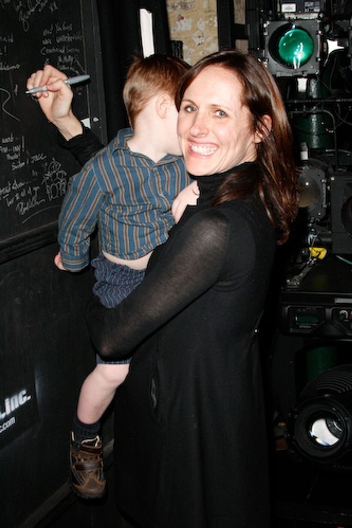 Molly Shannon and son Nolan Shannon Chestnut sign the special-guest wall at 