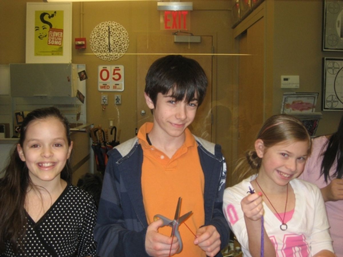  Kelsey Fowler (Sunday in the Park), Henry Hodges (Mary Poppins) and Gabby Malek (Chitty Chitty Bang Bang) make bracelets to send to the troops in Iraq and the Nyumbani Orphanage in Africa. at 