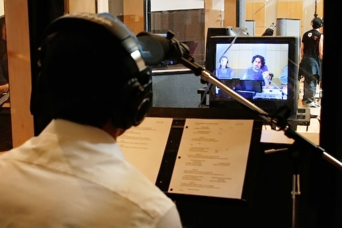 Lin-Manuel Miranda gets direction from Alex Lacamoire over a monitor at 