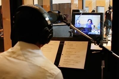 Lin-Manuel Miranda gets direction from Alex Lacamoire over a monitor Photo