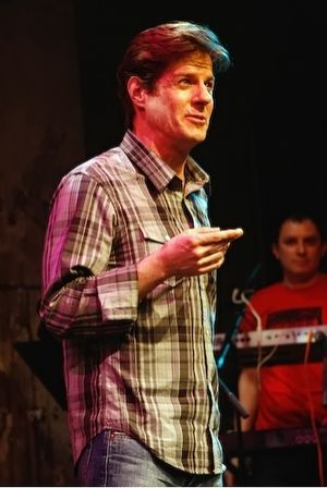 Rick Holmes as a film-noire narrator
@ BroadwayWorld Rick Holmes as a film-noire narrator
Photo