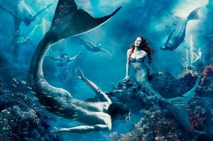 Julianne Moore, as Ariel, and world champion swimmer Michael Phelps, as a merman, sta Photo