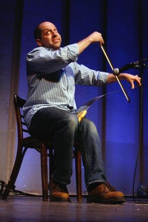 Jason Kravits plays 'Somewhere Over The Rainbow' on his saw Photo