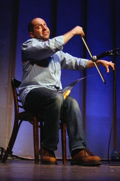 Jason Kravits plays 'Somewhere Over The Rainbow' on his saw Photo