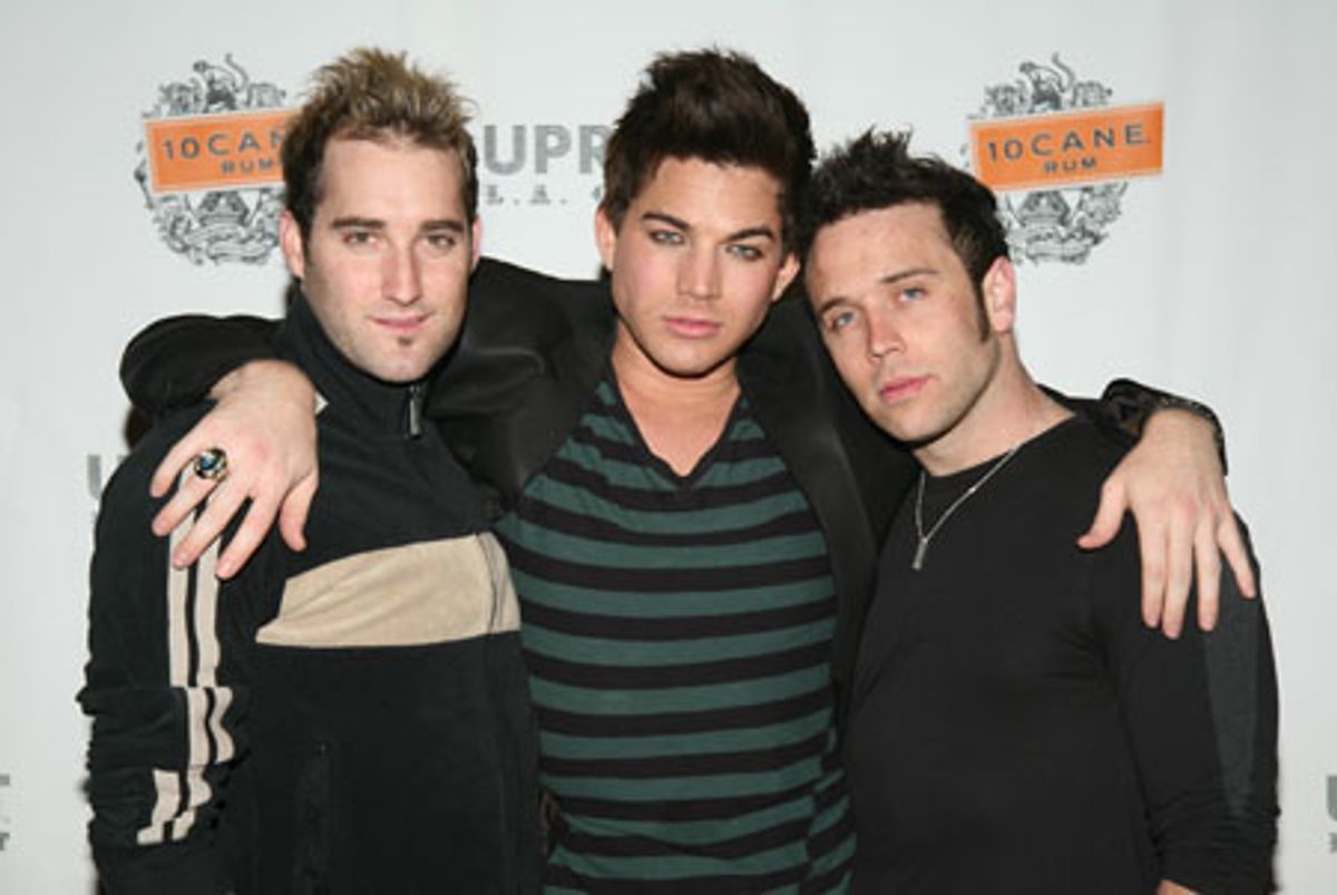 Adam Lambert flanked by friends at 