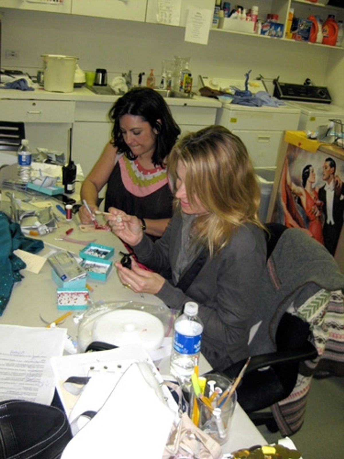 Lucy Lawless helping to bedazzle my bracelets in wardrobe at 