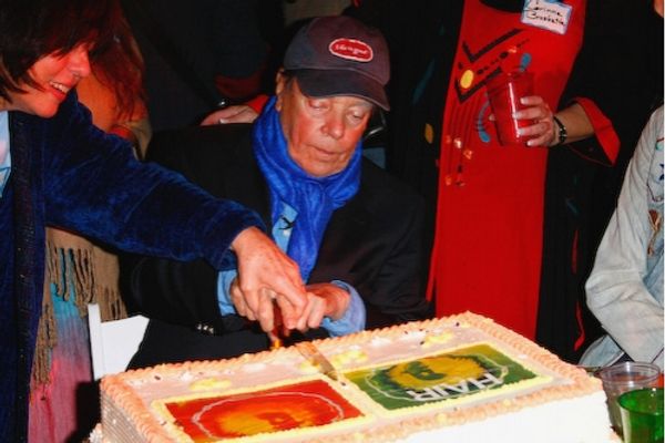 Tom O'Horgan cuts the cake Photo