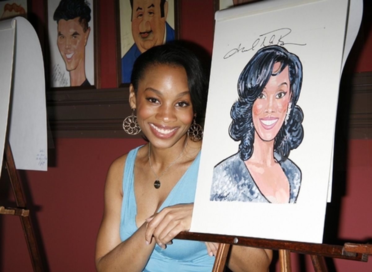 Anika Noni Rose with her caricature at 