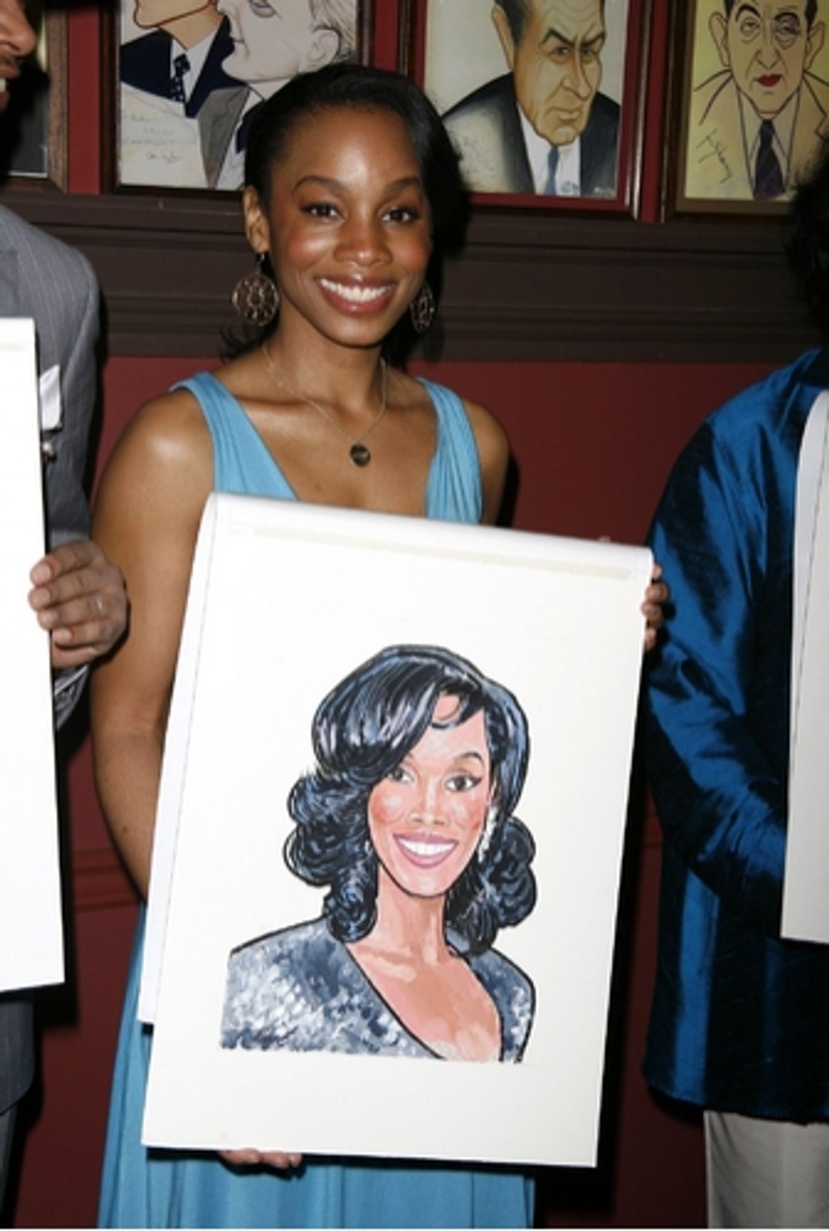 Anika Noni Rose with her caricature at 