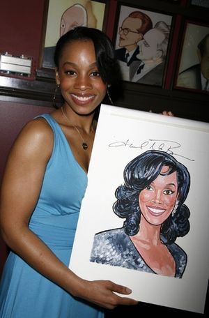Anika Noni Rose with her caricature @ BroadwayWorld Anika Noni Rose with her caricature Photo