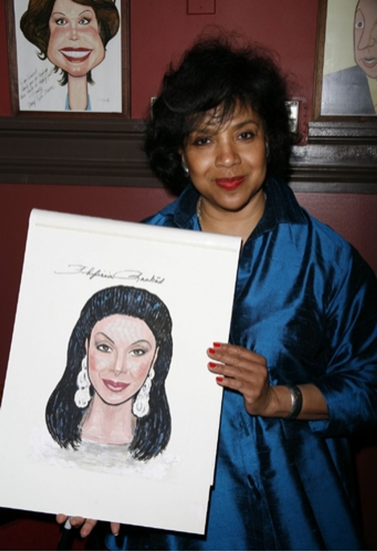 Phylicia Rashad with her caricature
 at 