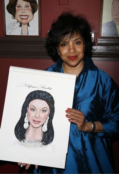 Phylicia Rashad with her caricature
 Photo
