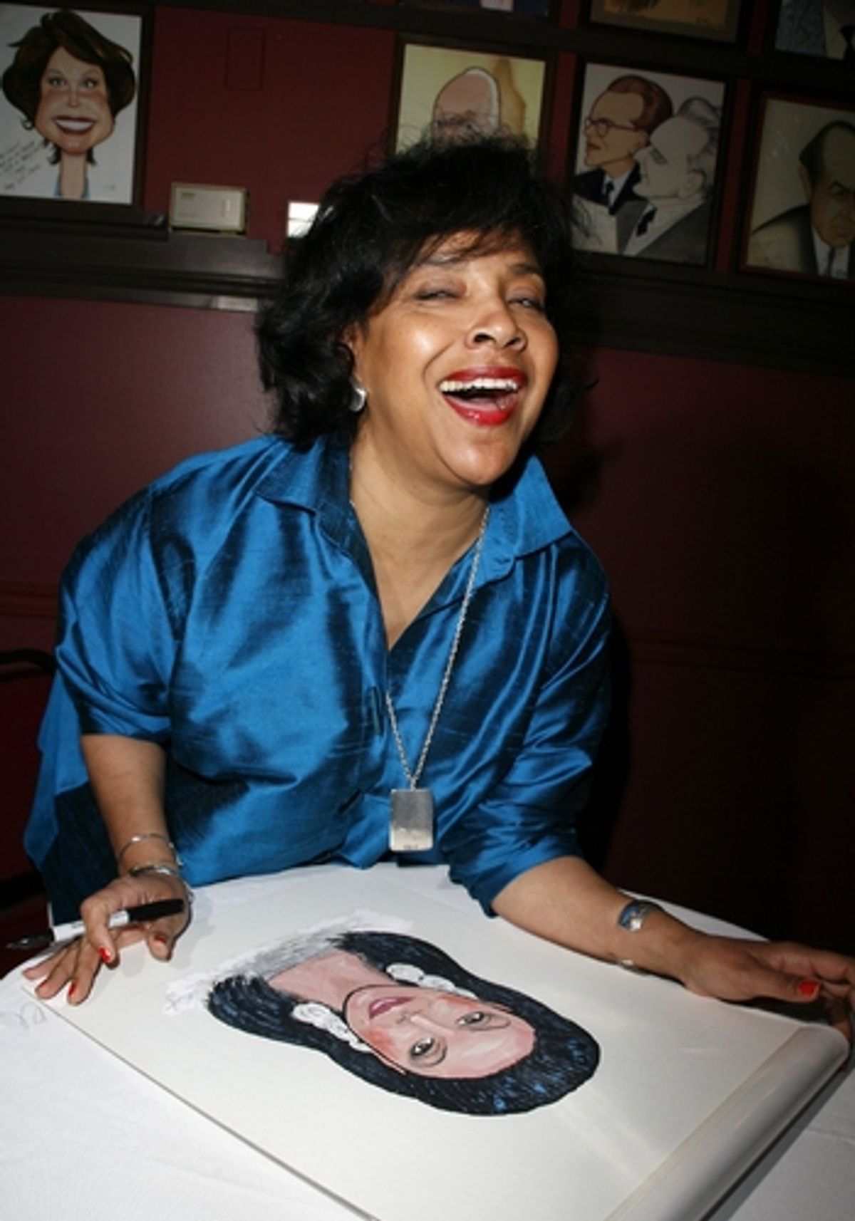 Phylicia Rashad with her caricature
 at 