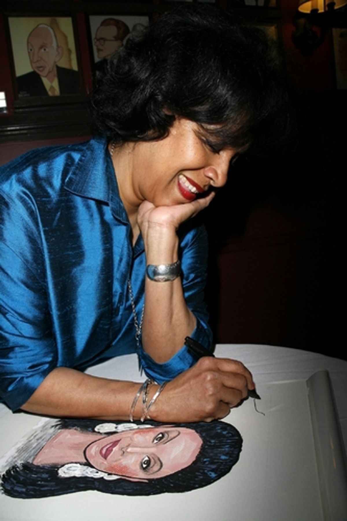 Phylicia Rashad with her caricature
 at 