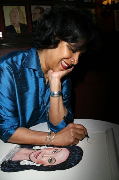 Phylicia Rashad with her caricature
 Photo